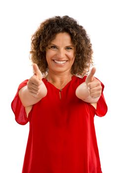 Portrait of a smiling middle aged brunette with thumbs up