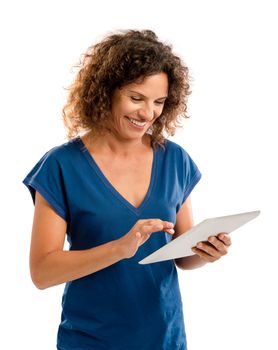 Beautiful middle aged woman working on a tablet
