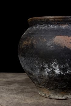 Fragment of antique pottery on a black background