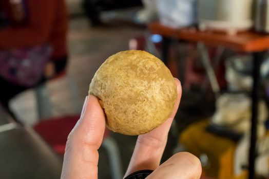 The close up of Taiwan deep fried taro ball at food street night market in Taipei.