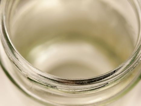 the rim of a glass jar up close clear and shining no lid