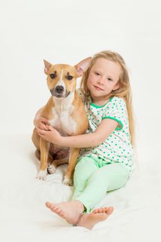 the little girl and dog on the isolated background