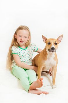 the little girl and dog on the isolated background