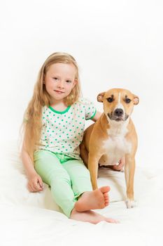 the little girl and dog on the isolated background