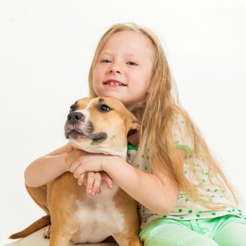 the little girl and dog on the isolated background