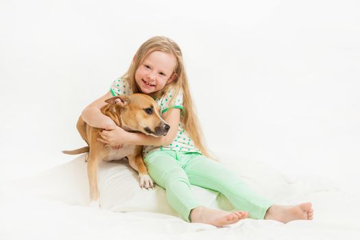 the little girl and dog on the isolated background