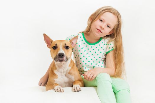 the little girl and dog on the isolated background