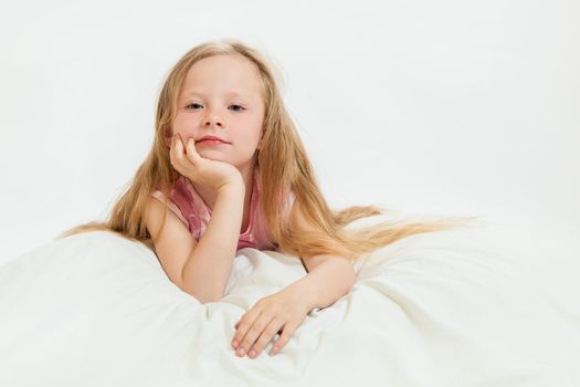 the beautiful little girl on the isolated background