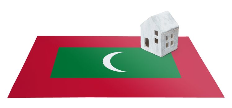 Small house on a flag - Living or migrating to Maldives