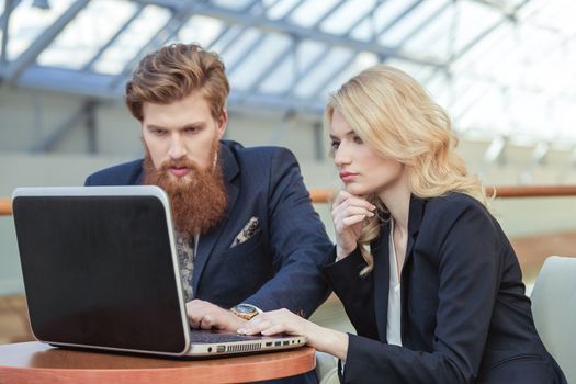 business couple working together on project at modern office