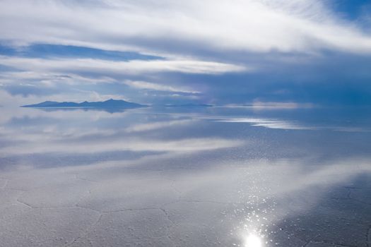 Sunset in Salar de Uyuni salt flats desert, Andes Altiplano, Bolivia