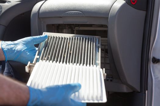Clean and dirty cabin air filter for the car. Changing the cabin air filter.