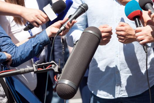 Journalists or reporters making media interview with unrecognizable person