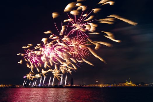 Colored New Year fireworks in centre of Riga