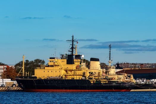 Yellow icebreakers moored at the port of Riga, Europe
