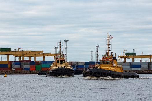 Tug ships in the cargo port of Riga, Europe