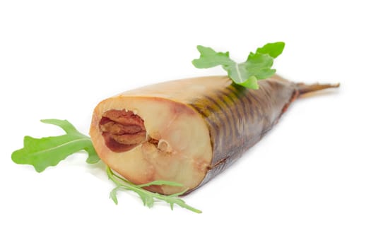 Piece of the cold-smoked Atlantic mackerel with caviar and several arugula leaves closeup on a light background
