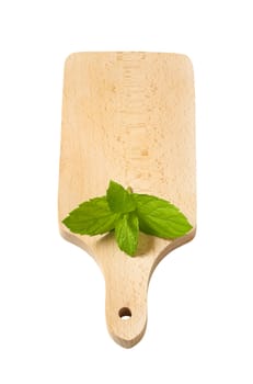 fresh mint leaves on wooden cutting board