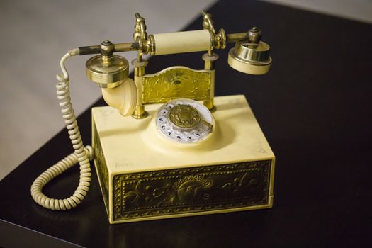 Vintage telephone over retro background