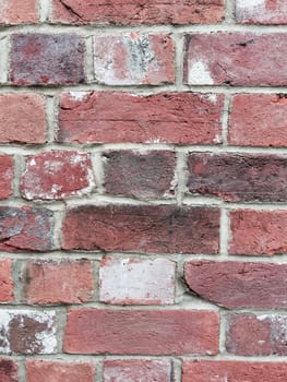 Old and dirty brick wall with broken structure in Bedfordshire.