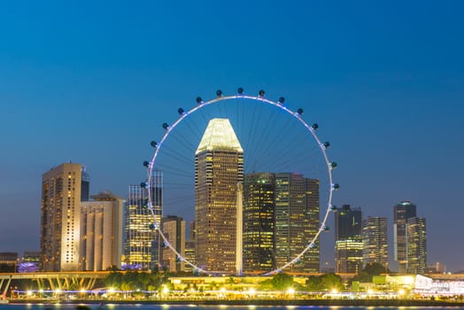 Singapore landmark city skyline at the Marina bay during twilight.