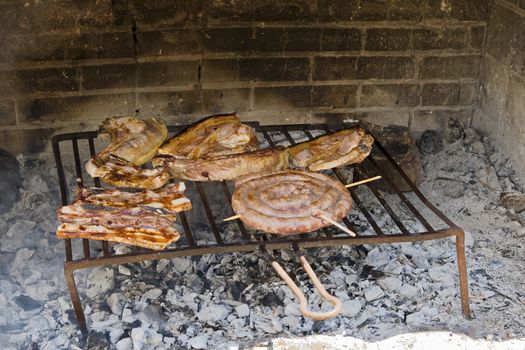 Meat roast in the barbecue in the countryside