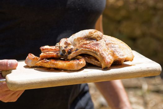 Meat roast in the barbecue in the countryside