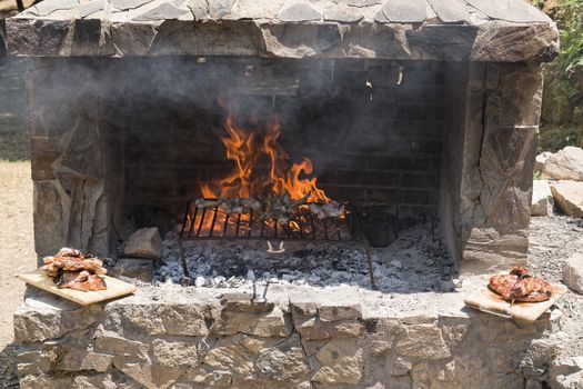 Meat roast in the barbecue in the countryside