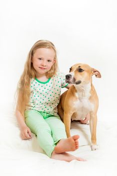 the little girl and dog on the isolated background