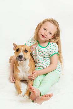 the little girl and dog on the isolated background