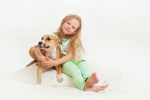 the little girl and dog on the isolated background