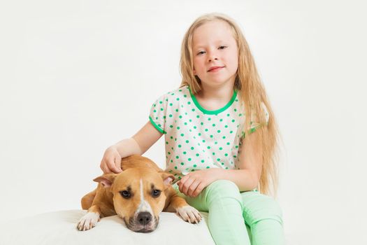 the little girl and dog on the isolated background