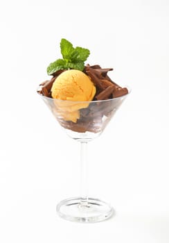Scoops of ice cream with chocolate curls in stemmed glass