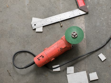 COLOR PHOTO OF PLUGGED ELECTRIC GREEN WHEEL GRINDER