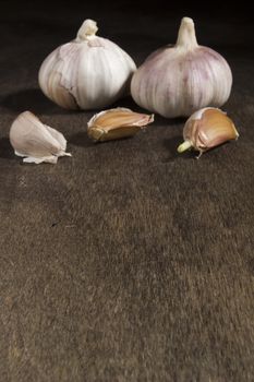 Ripe fresh garlic on a brown wooden table