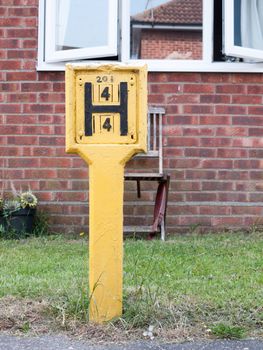 yellow h sign outside hydrant fire safety