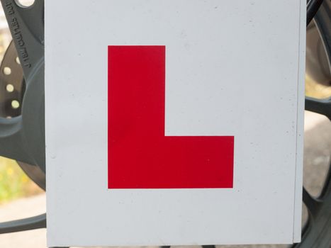 close of a learning sign on a bike wheel