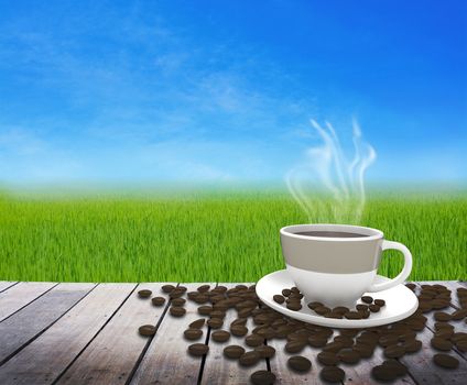 Cup with tea on table over green grass landscape