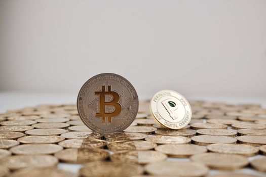 Cryptocurrency physical silver bitcoin coin and gold peer coin physical money.