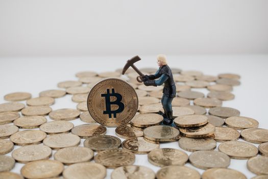 Cryptocurrency physical gold bitcoin coin and picking miner