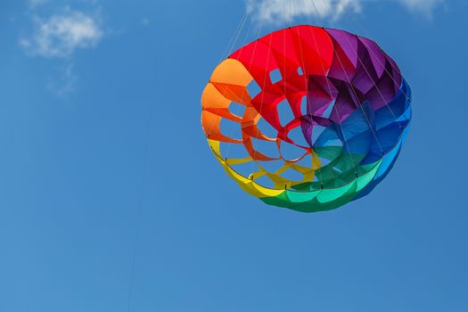 kites flying in a blue sky. Kites of various shapes. kiting