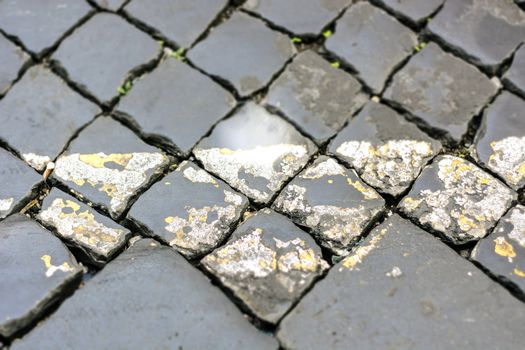 close up of a typical roman street made with cobblestone (sanpietrino).