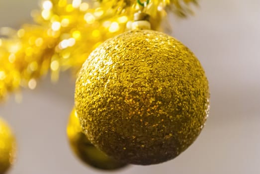 Shiny golden ball for Christmas tree decoration hanging