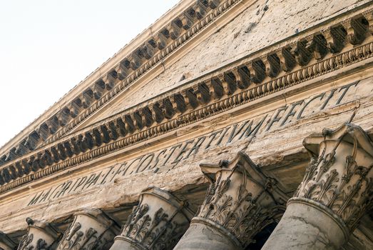 close up of the Pantheon pediment with latin inscription, corinthian capital columns, Rome, Italy