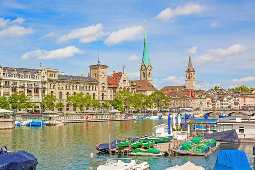 Panorama of historical part of Zurich with famous Fraumunster and St. Peter church on a beautiful summer day, Switzerland
