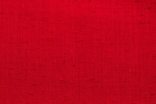 Rustic canvas fabric texture in red color.