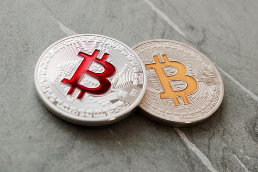 Digital currency physical silver bitcoins on the granite plate.