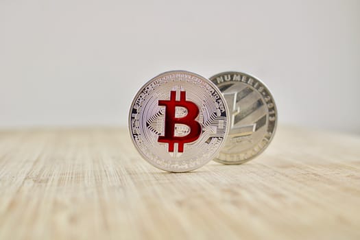 Digital currency physical silver bitcoin coin and Litecoin. Business concept.