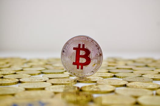 Digital currency physical silver bitcoin coin with red sign. Business concept.