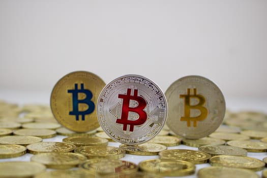 Digital currency physical silver and gold bitcoins on the money.
